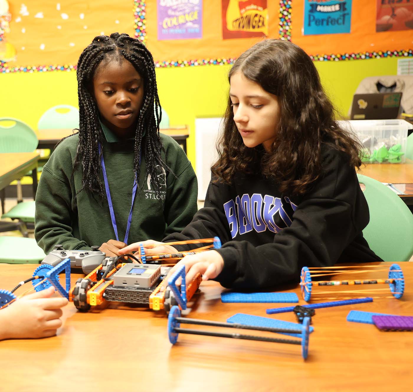 GSA St. Louis Smiley student drawing at a desk in a classroom setting