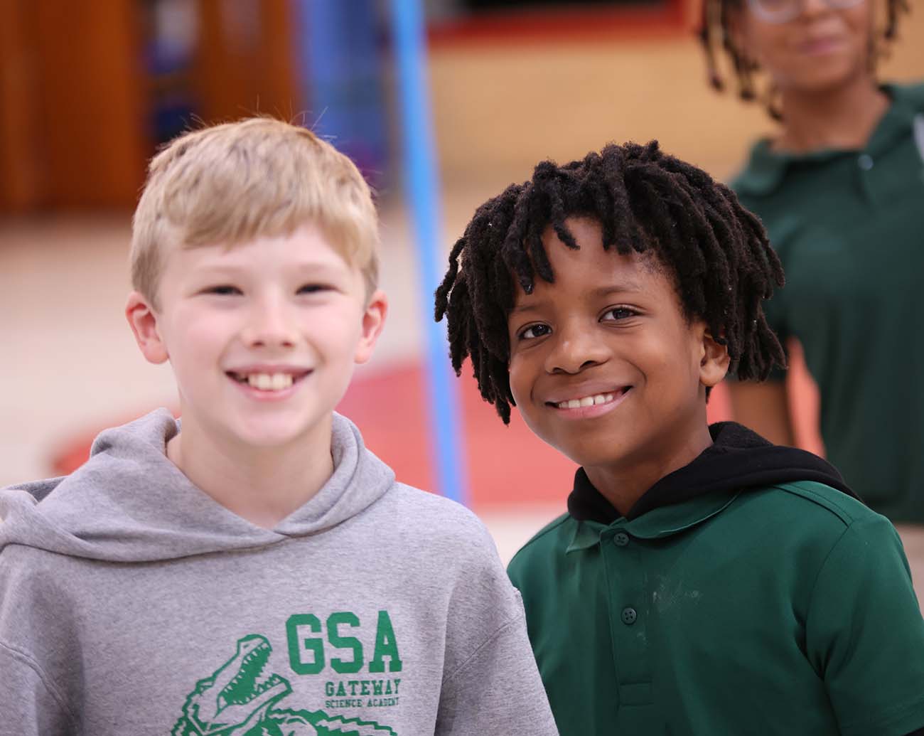 Teacher or school staff member warmly interacting with a student outside